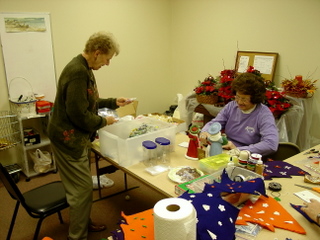 Sandy & friend work on decorations